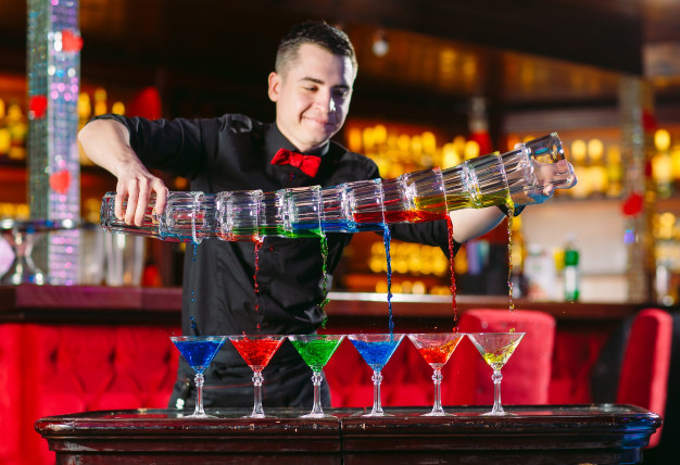 barman-show-bartender-pours-alcoholic-cocktails_109285-3159